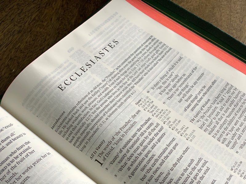 Close-up of open Bible page showing the beginning of the Book of Ecclesiastes.
